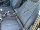 the interior of a car with two black seats and a steering wheel
