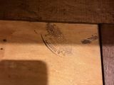 a shadow of a person on a wooden table