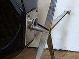 an image of a car wheel with a pair of scissors attached to it