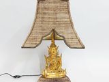 an image of a golden buddha lamp on a white background