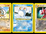 trois cartes Pokémon présentant des motifs différents sur un fond noir