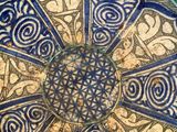 a blue and white plate with a decorative design on it