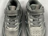 a close up of a pair of baby shoes on a table