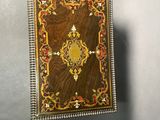 an old wooden box with a decorative design on it