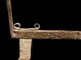 a metal object that is sitting on a black surface