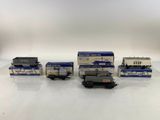 a group of toy trains sitting on top of a white table