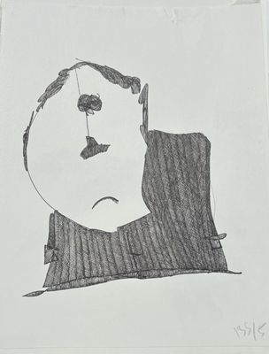 a drawing of a man with a sad face on a piece of paper