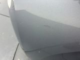 the front bumper of a car with scratches on the side of it