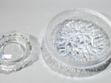 a clear glass container with a ring inside of it