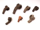 an image of a collection of ancient artifacts on a white surface