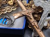 a box of gold and silver jewelry on a table