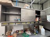 a kitchen with stainless steel cabinets and shelves in it