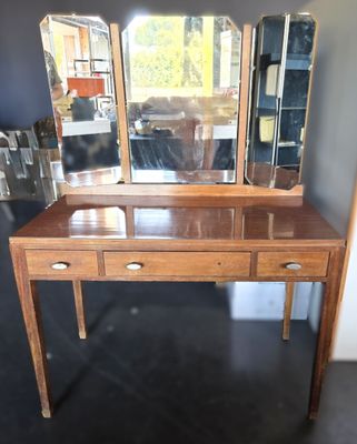 an image of a wooden dressing table with three mirrors on top of it