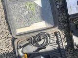 two tools in a case on the ground