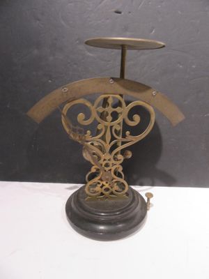 a clock that is on a stand on a table