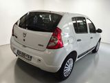 a small white car that is parked in a room