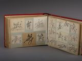 an open book with drawings of people riding horses