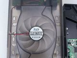 a hard drive with a fan and a hard drive with a hard drive in it