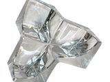 a glass sculpture of a cross on a white surface