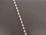 a silver necklace with a tag that says ` person ' on it