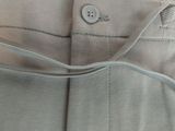 the back of a pair of pants with a button on the side