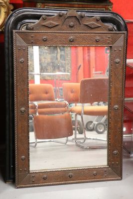 a mirror that is sitting on a table in front of a chair