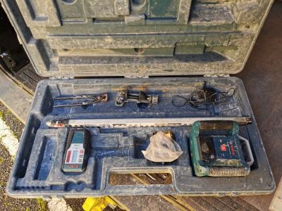 a tool case with tools inside of it on the ground