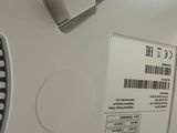 a close up of a laptop with a barcode on it