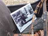 an old photo of a man and a woman in an old car
