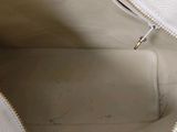 the inside of a white purse with a zipper on it
