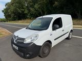 a white van that is parked on the side of the road