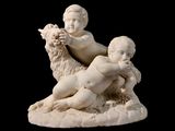 une statue représentant un enfant et un mouton sur fond noir