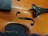 a close up of a violin that is being worked on