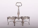 a silver plate with two bowls on top of it