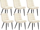 quatre chaises aux pieds noirs et à l'assise rembourrée blanche