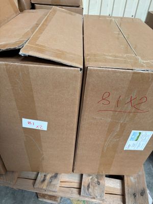 a stack of boxes sitting on a pallet in a warehouse