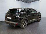 the rear view of a black suv parked in a garage