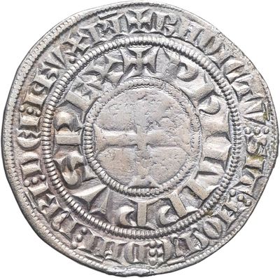 gros plan d'une pièce de monnaie en argent sur fond blanc