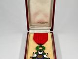a red box with a medal and a star on it