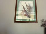 a picture of a picture of a bird on the wall