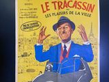 poster of a man in a blue suit and hat with his hands in the air in front of a car