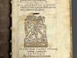 an old book with a picture of a man holding a sword