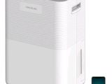 une photo d'un climatiseur blanc posé à côté d'un téléphone portable