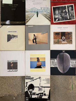 a lot of different album covers on the wall