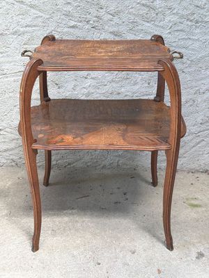 a small wooden table with two shelves on it