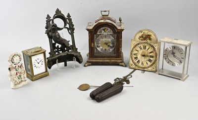 many different types of clocks sitting on a table