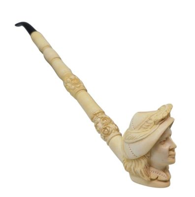 an image of a carved pipe with a man ' s head on it