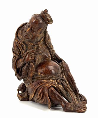 an image of a statue of a person sitting on a chair