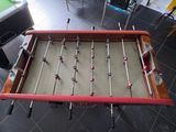 a foosball table in the middle of a game room