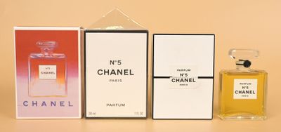 three perfume bottles are lined up on a table next to each other